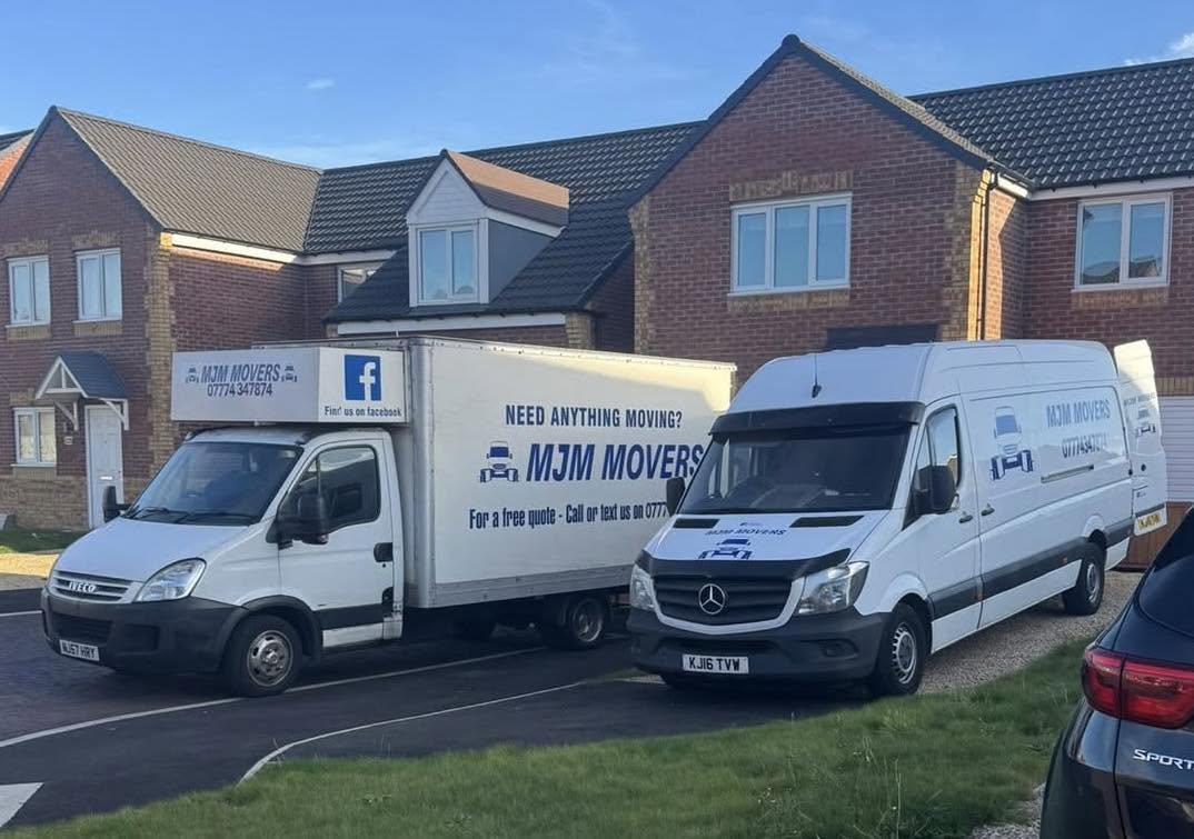 Two real MJM Movers removal vans ready for a household move