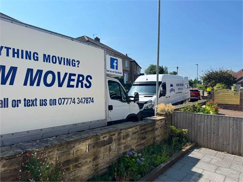 Two MJM Movers vehicles at a real customer move